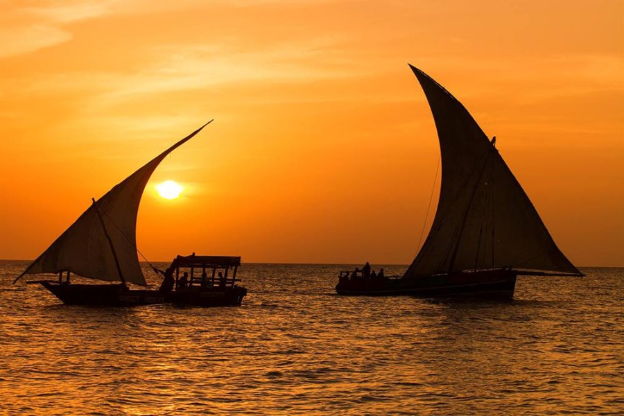 Traditional Dhow Sailing at Sunset
